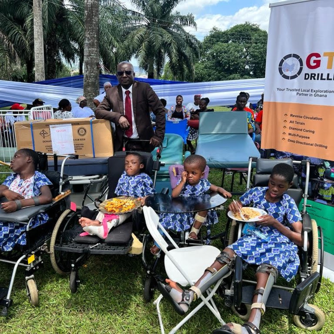 Photo caption: Mr Iddi Baah- Kurey of GTS Drilling with children who received specialised wheelchairs