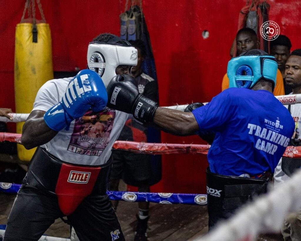 Theophilus Allotey training in the boxing ring with GTS Drilling support